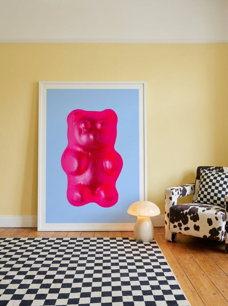 Oversized statement modern wall art print leaning against the wall in a colourful eclectic bedroom