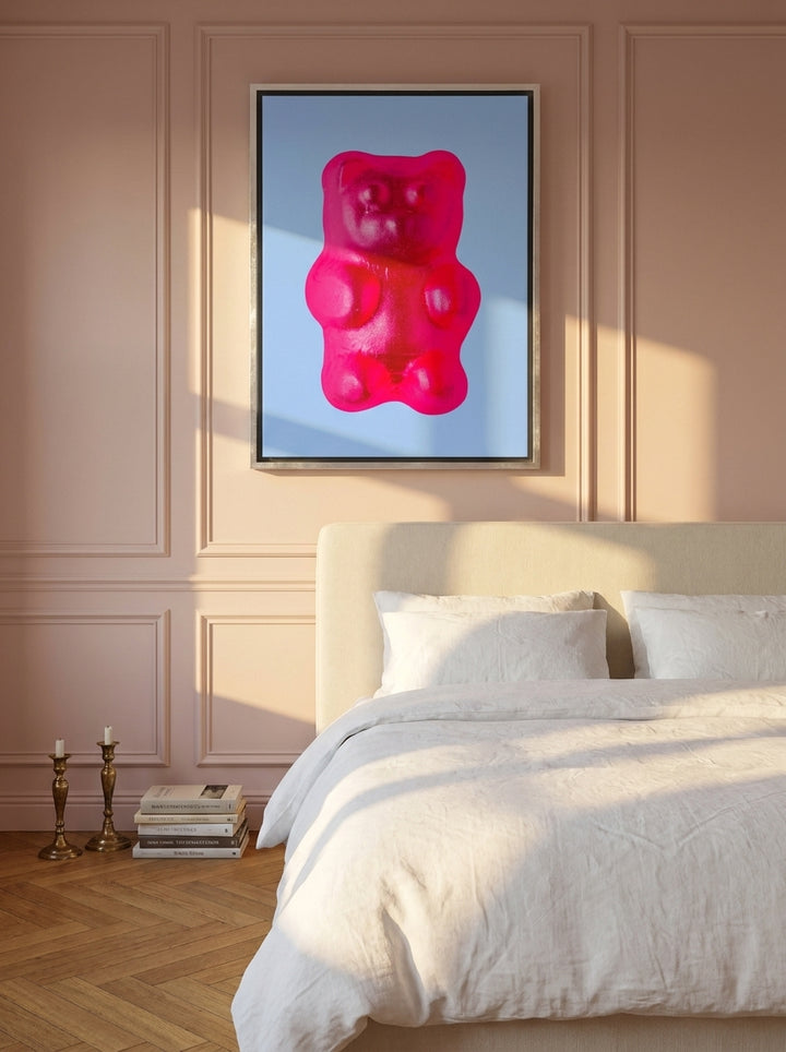Canvas wall art with a silver leaf surround styled on the wall in a Parisian bedroom