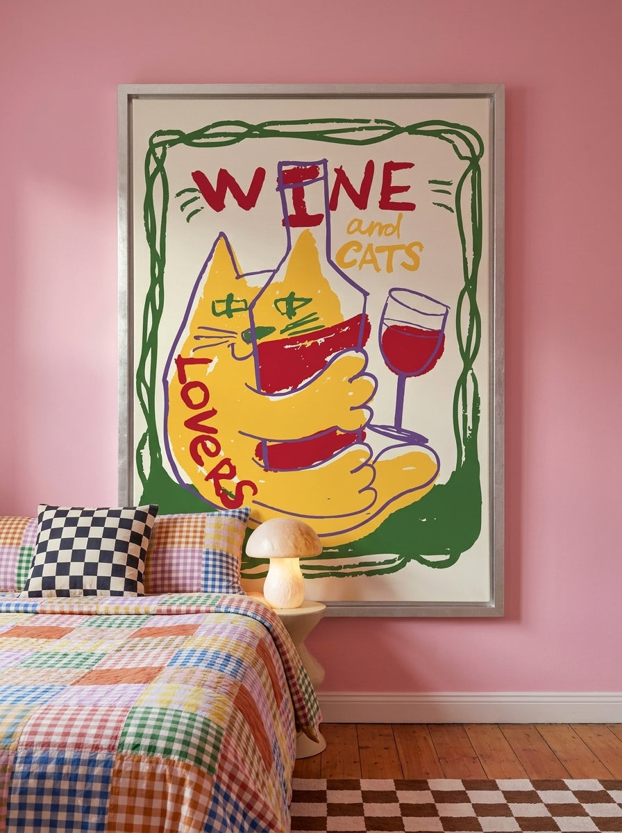 Canvas wall art with a silver leaf surround styled on the wall in a colourful eclectic bedroom