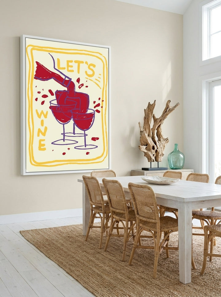 Oversized statement canvas wall art with a white surround styled on the wall in a coastal dining room