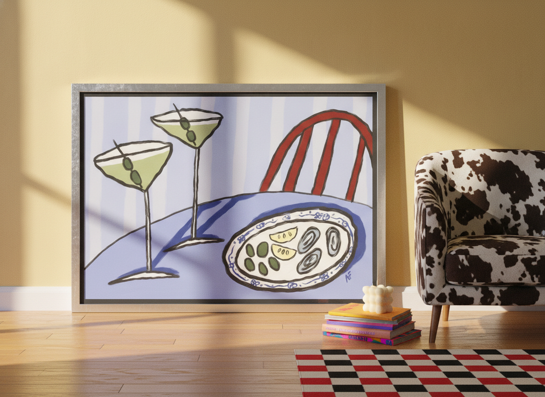Canvas wall art with a silver leaf surround leaning against the wall in a colourful eclectic living room