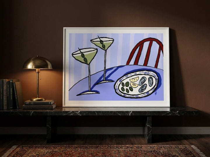 Modern wall art print standing on a kitchen bench in a moody kitchen
