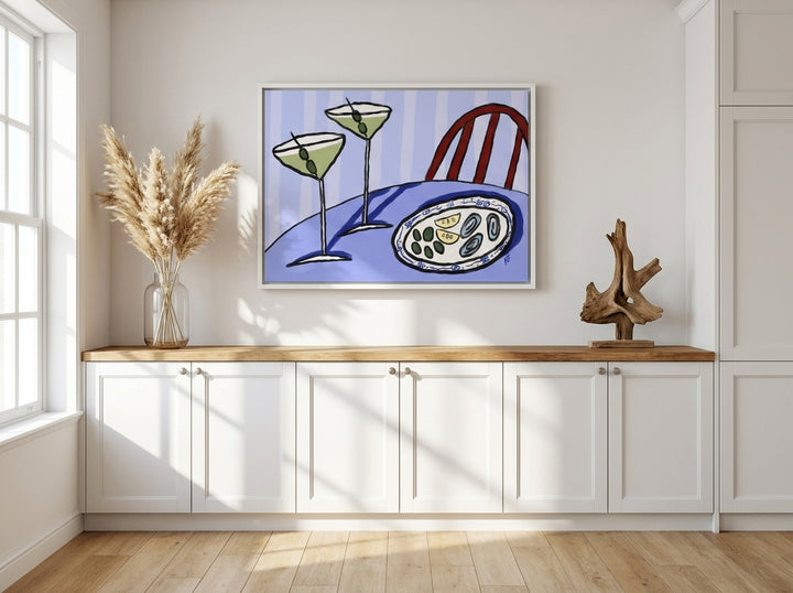 Canvas wall art with a white surround styled on the wall in a coastal kitchen