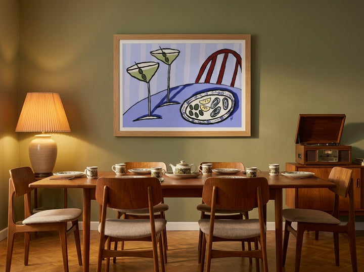 Modern wall art print styled on the wall in a mid-century dining room