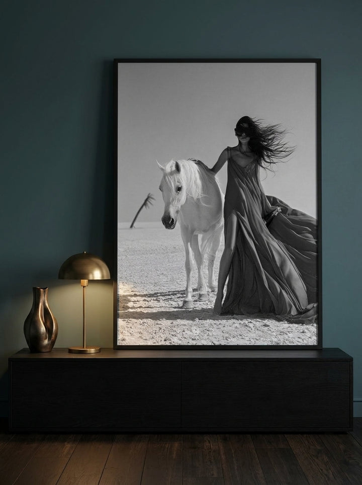 Modern wall art print standing on a console in a moody bedroom