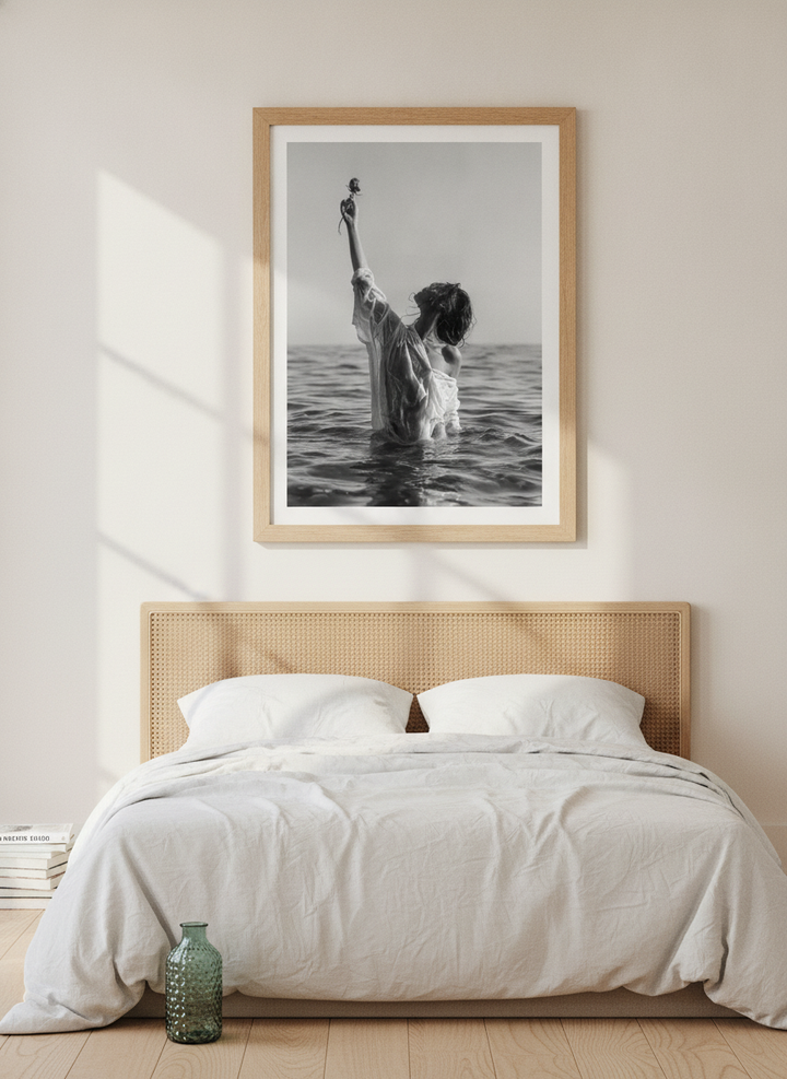 Modern wall art print styled on the wall in a coastal bedroom