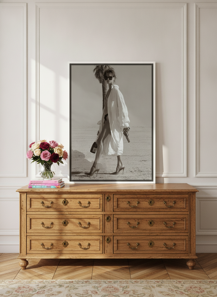 Canvas wall art with a white surround standing on a sideboard in a Parisian home office