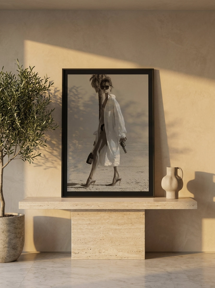 Modern wall art print standing on a console in a luxe bedroom