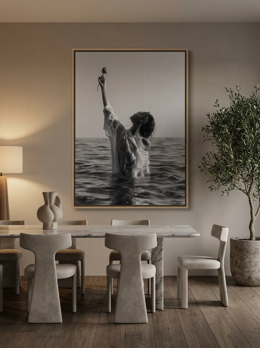 Oversized statement canvas wall art with a natural timber surround styled on the wall in a luxe dining room