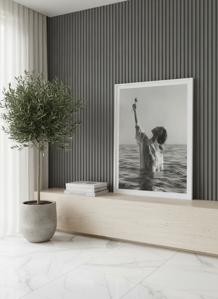 Modern wall art print standing on a console in a luxe living room