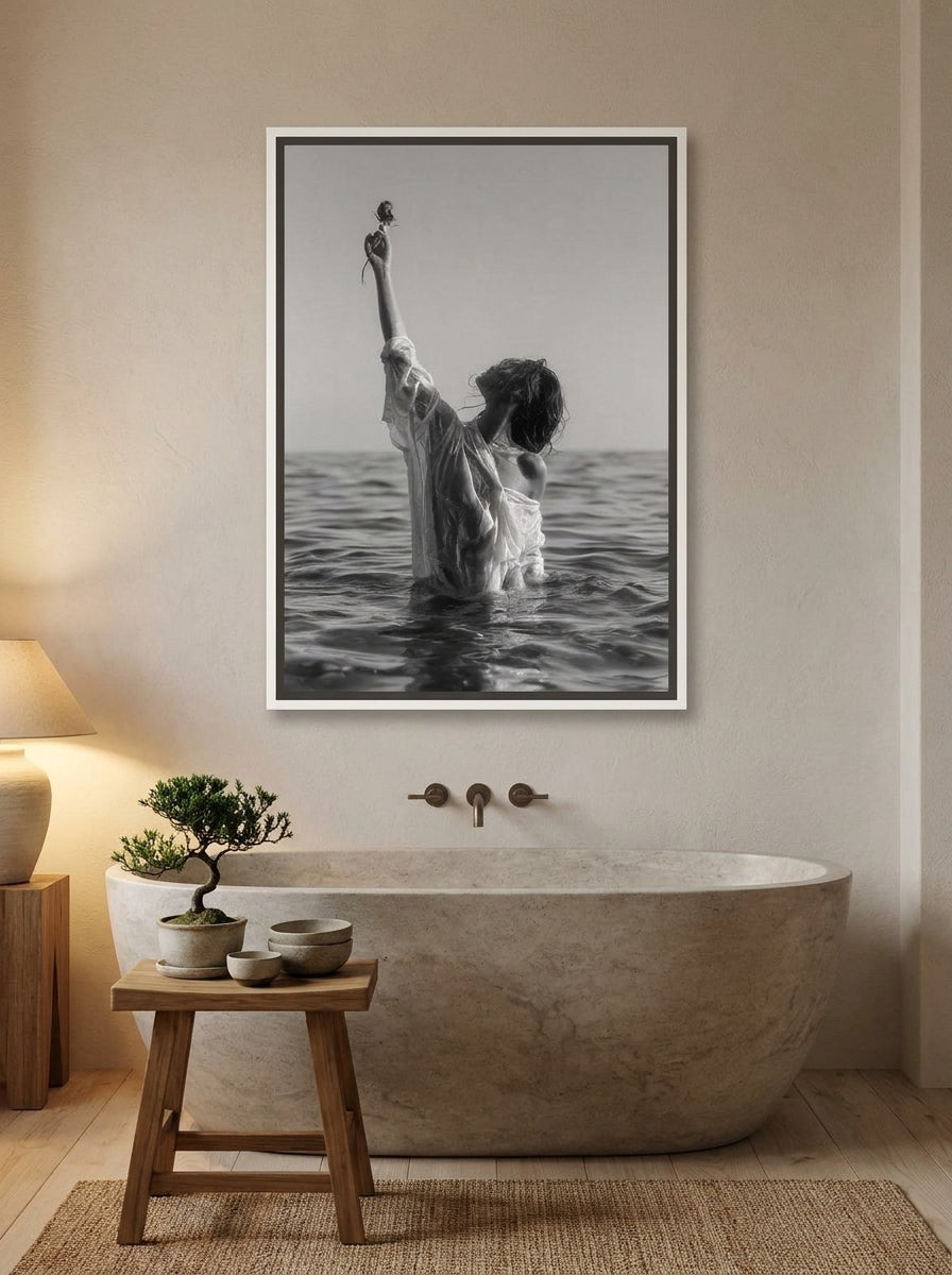 Canvas wall art with a white surround styled on the wall in a warm Japandi bathroom
