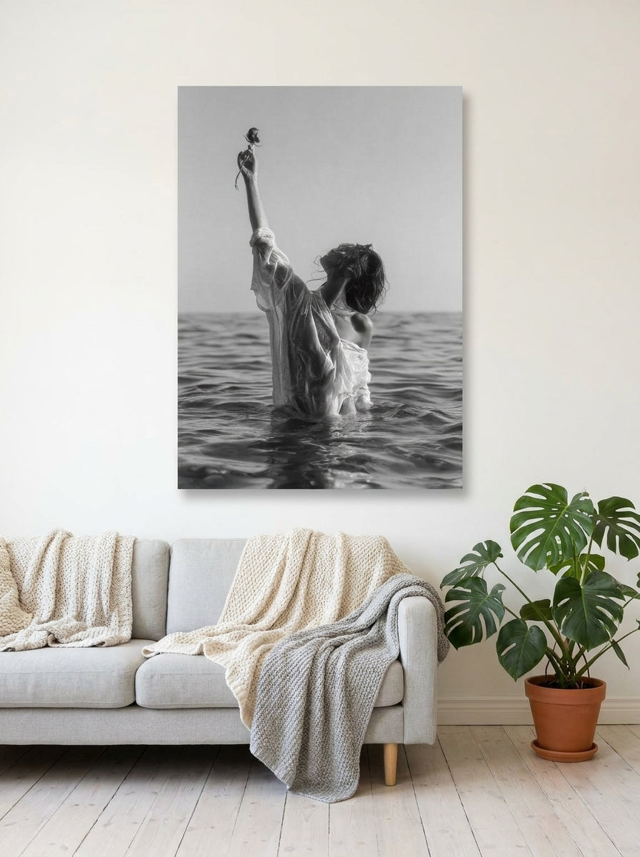 Stretched canvas wall art styled on the wall in a bright Scandinavian living room