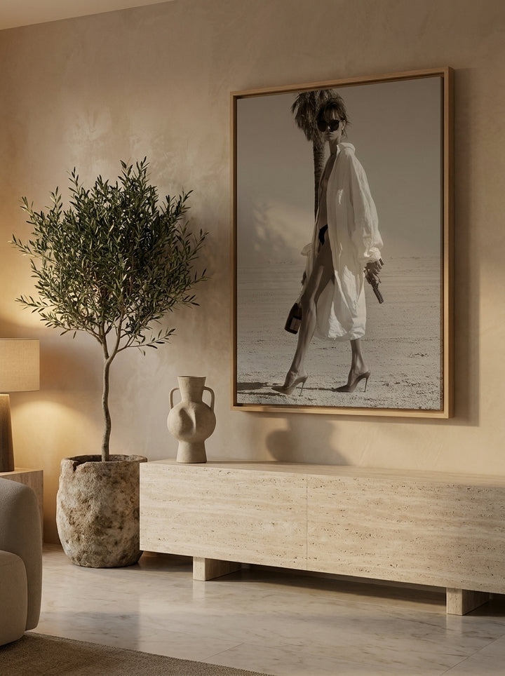 Oversized statement canvas wall art with a natural timber surround styled on the wall in a luxe living room