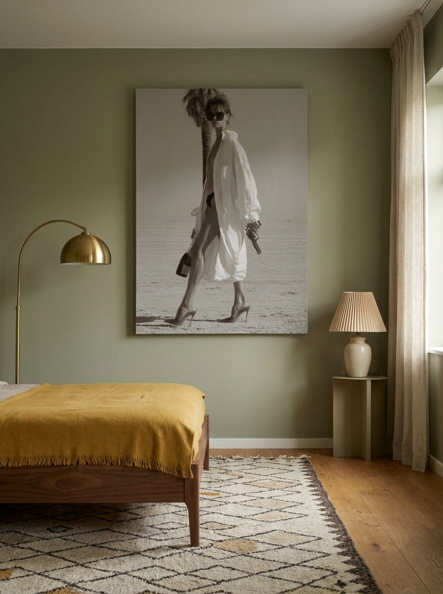 Stretched canvas wall art styled on the wall in a mid-century bedroom