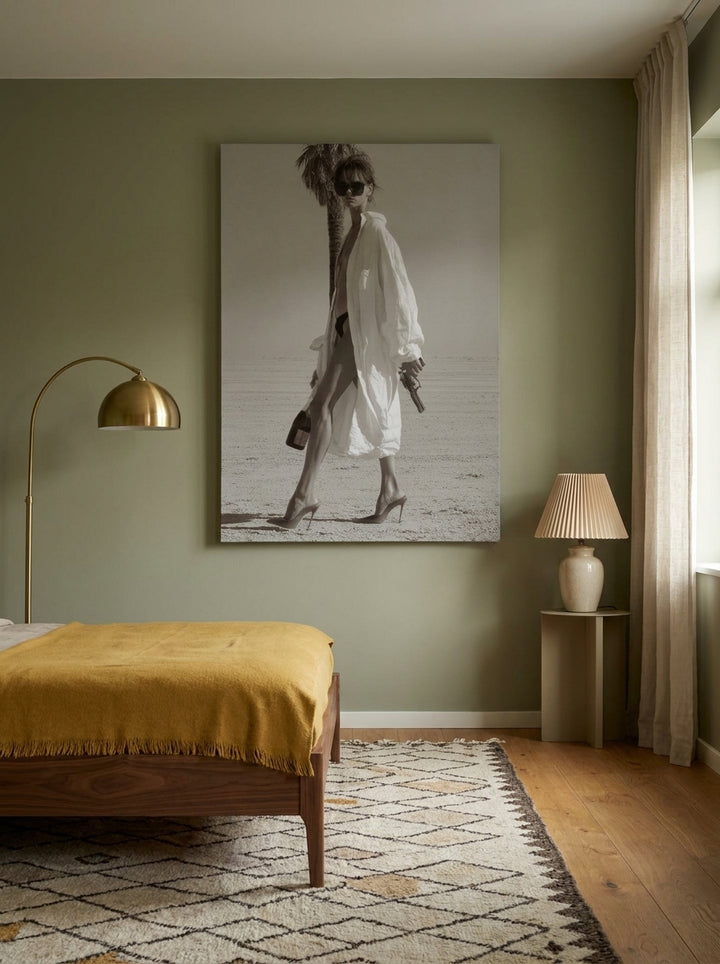 Stretched canvas wall art styled on the wall in a mid-century bedroom