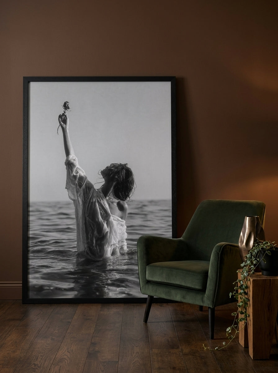 Oversized statement modern wall art print leaning against the wall in a moody living room
