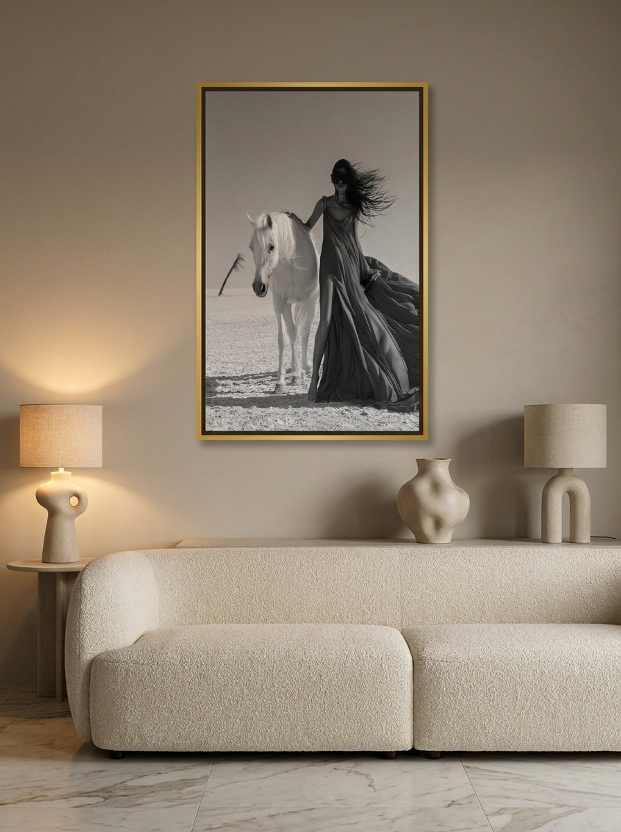 Canvas wall art with a gold leaf surround styled on the wall in a luxe living room