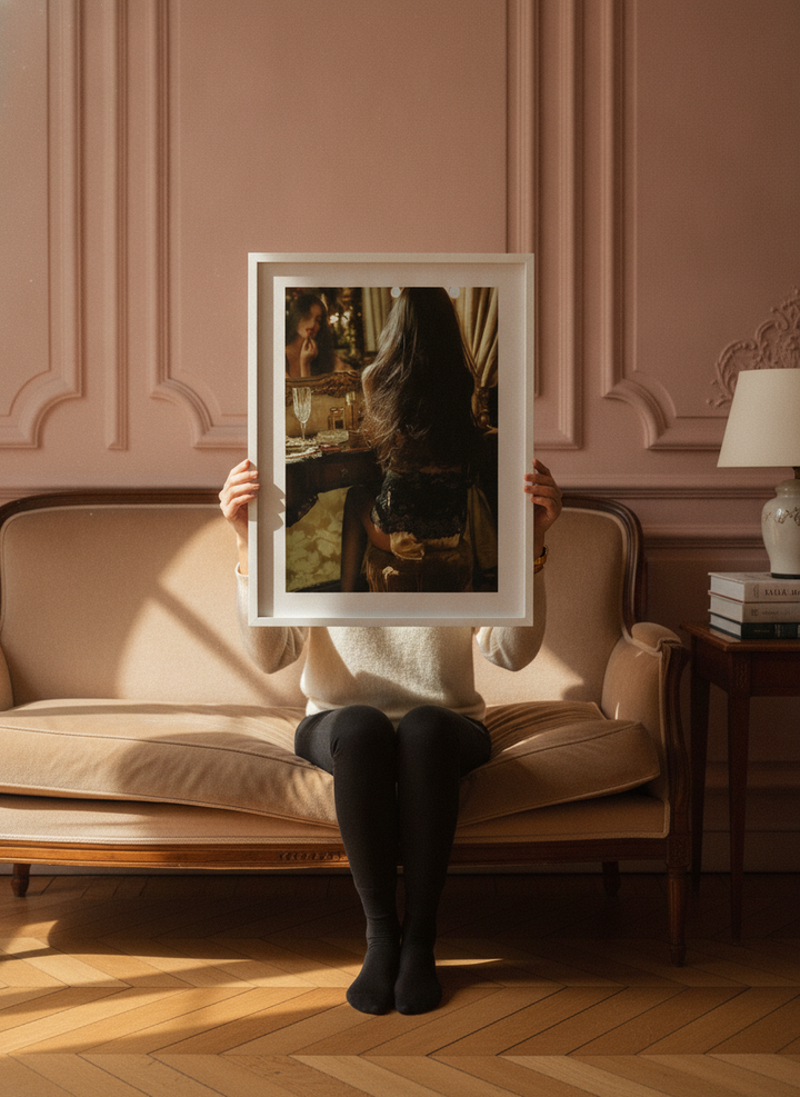 Person holding modern wall art print in a Parisian living room