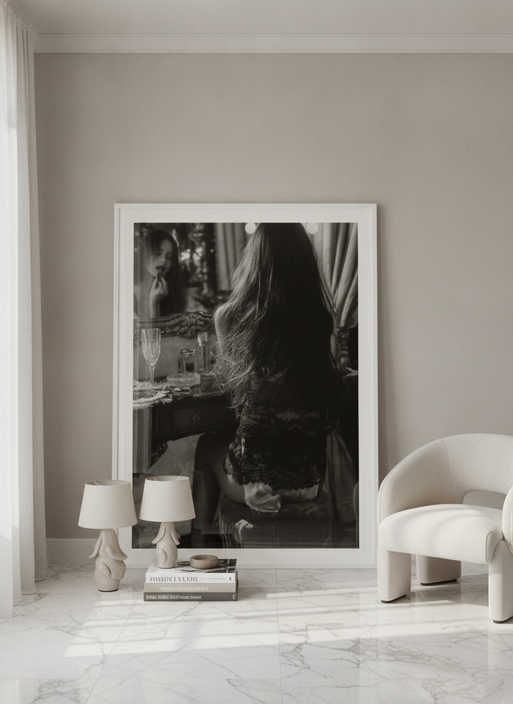 Oversized statement modern wall art print leaning against the wall in a luxe dining room