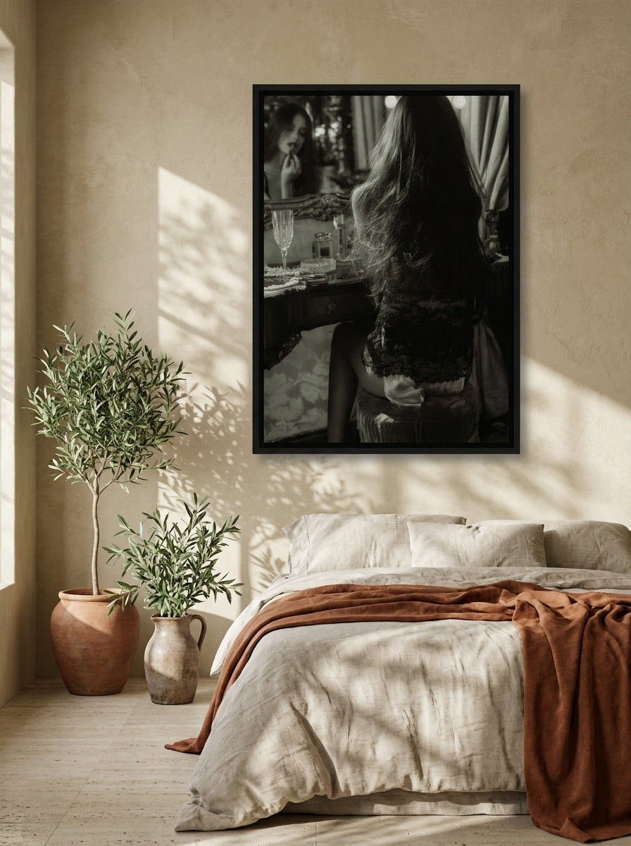 Canvas wall art with a black surround styled on the wall in a Mediterranean bedroom