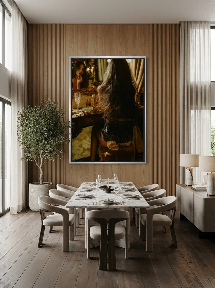 Oversized statement canvas wall art with a silver leaf surround styled on the wall in a luxe dining room