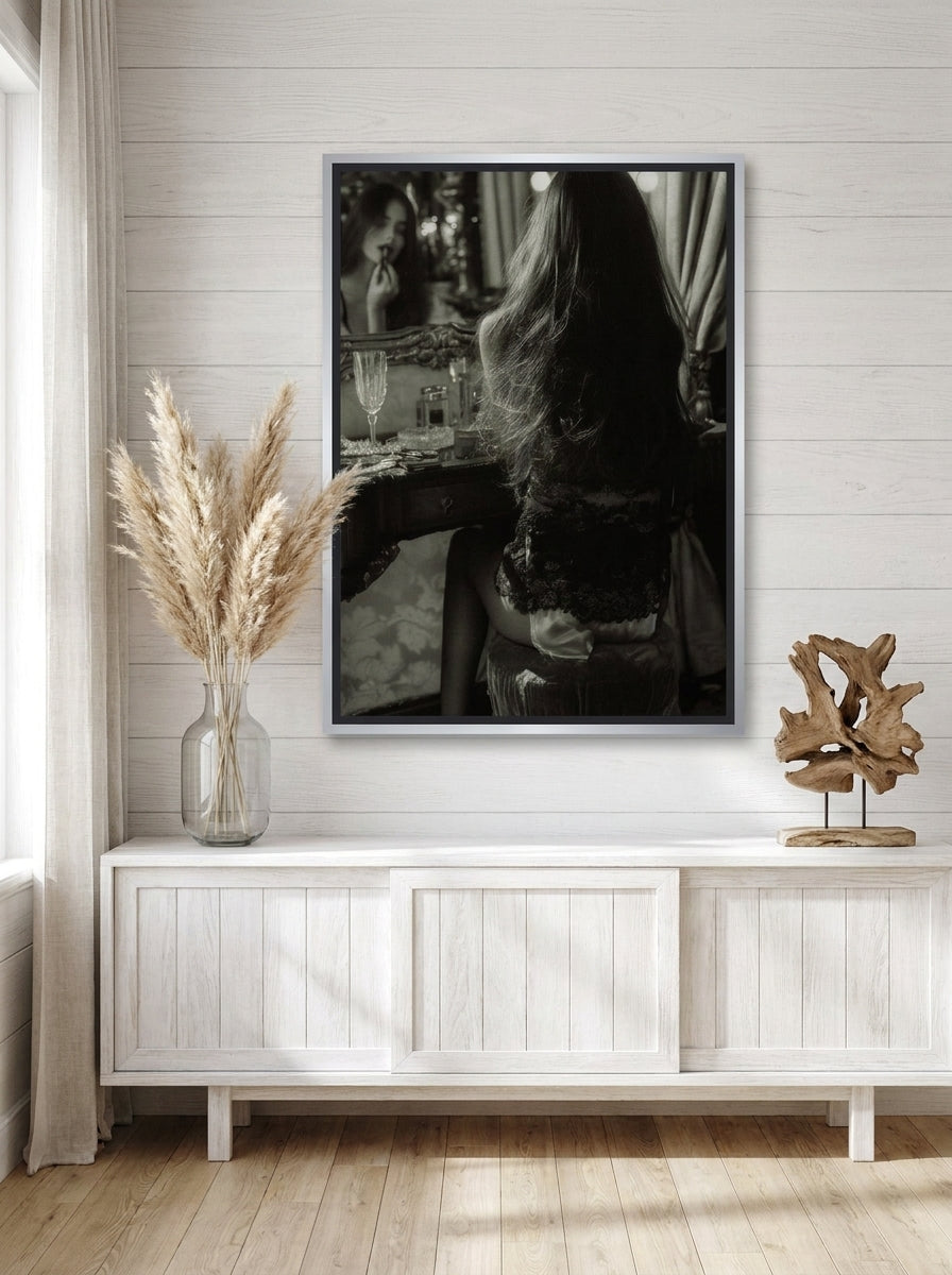 Canvas wall art with a silver leaf surround styled on the wall in a coastal living room