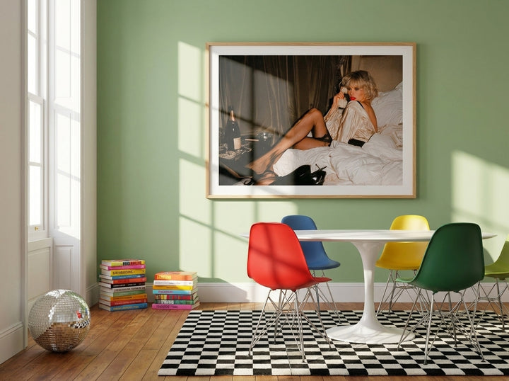 Oversized statement modern wall art print styled on the wall in a colourful eclectic dining room
