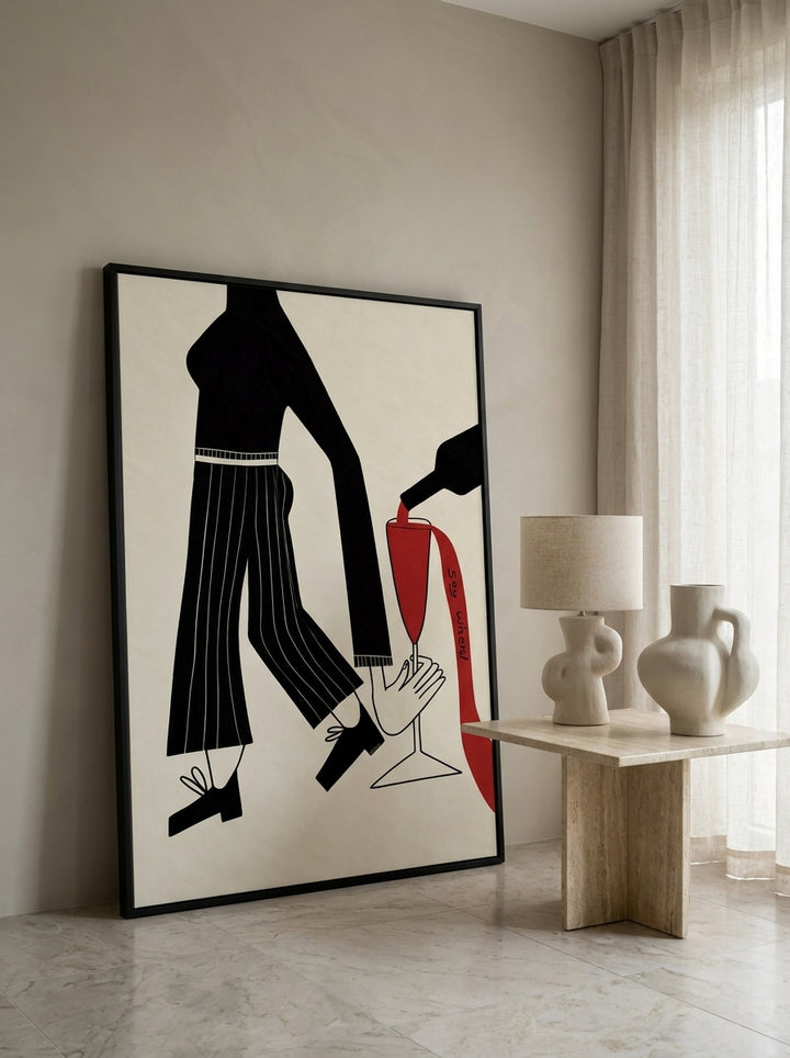 Oversized statement modern wall art print leaning against the wall in a luxe living room