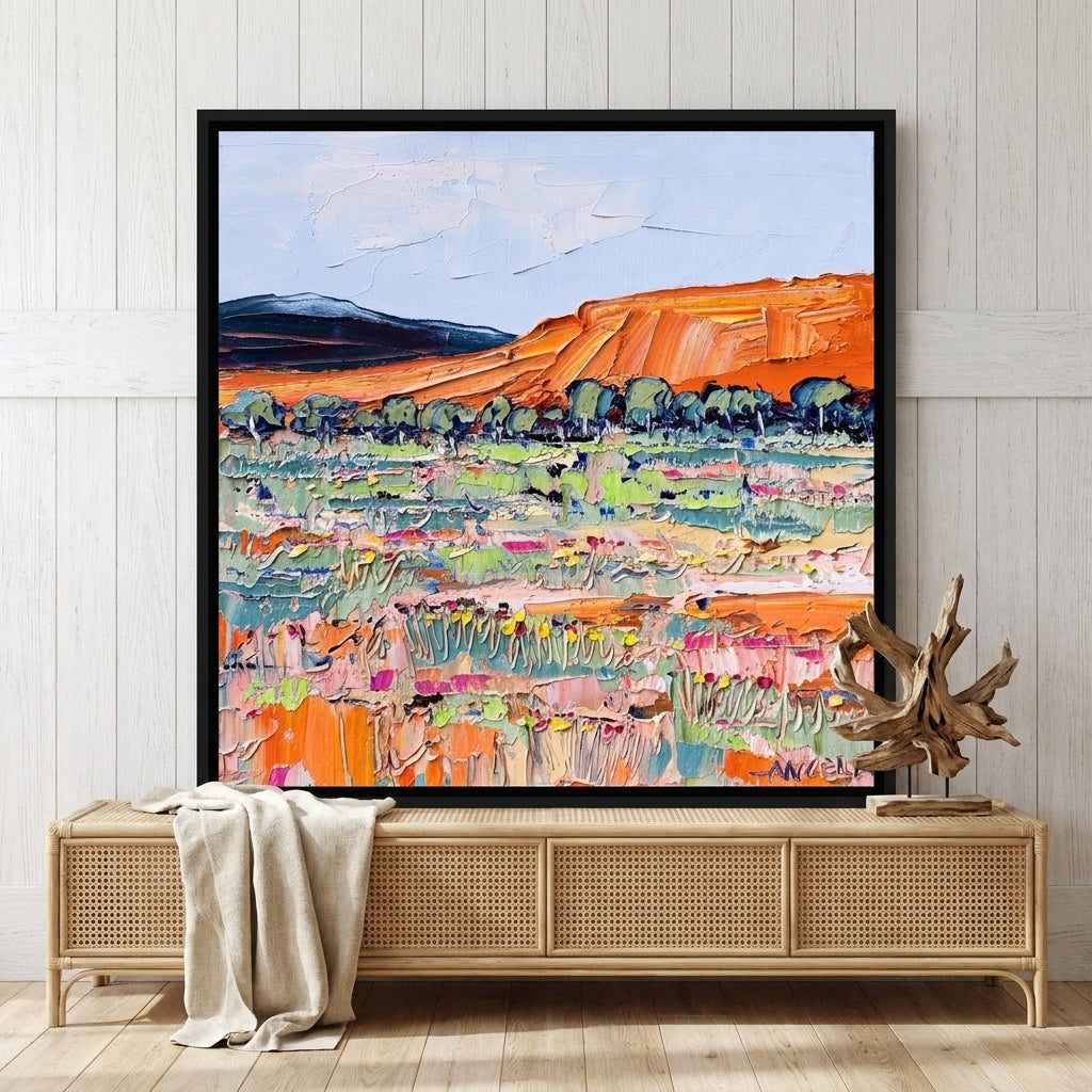 Canvas wall art with a black surround standing on a sideboard in a coastal home office