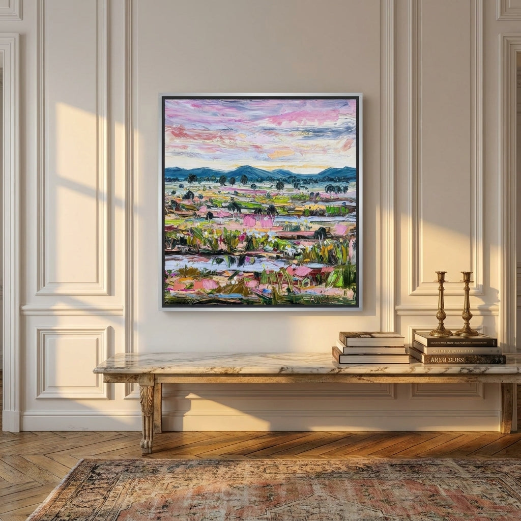 Canvas wall art with a silver leaf surround styled on the wall in a Parisian living room