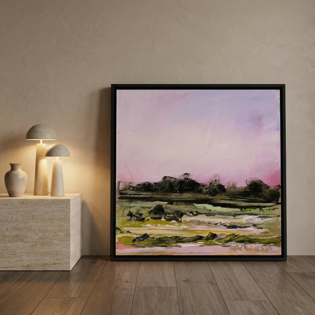 Oversized statement canvas wall art with a black surround leaning against the wall in a luxe bedroom