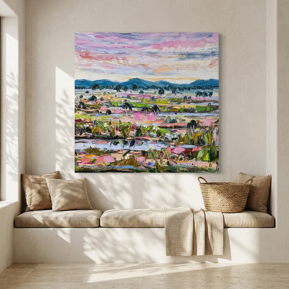 Stretched canvas wall art styled on the wall in a Mediterranean living room