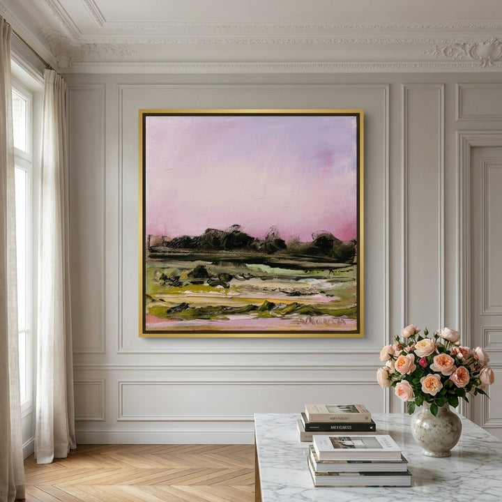 Oversized statement canvas wall art with a gold leaf surround styled on the wall in a Parisian living room