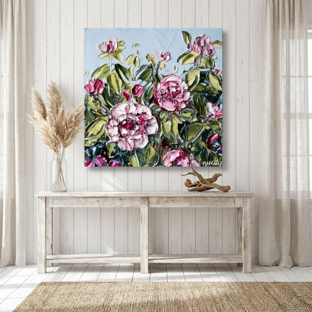 Stretched canvas wall art styled on the wall in a coastal living room
