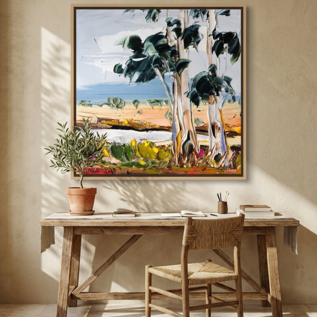 Canvas wall art with a natural timber surround styled on the wall in a Mediterranean home office