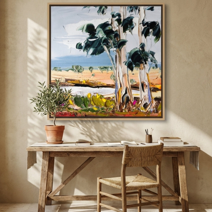 Canvas wall art with a natural timber surround styled on the wall in a Mediterranean home office