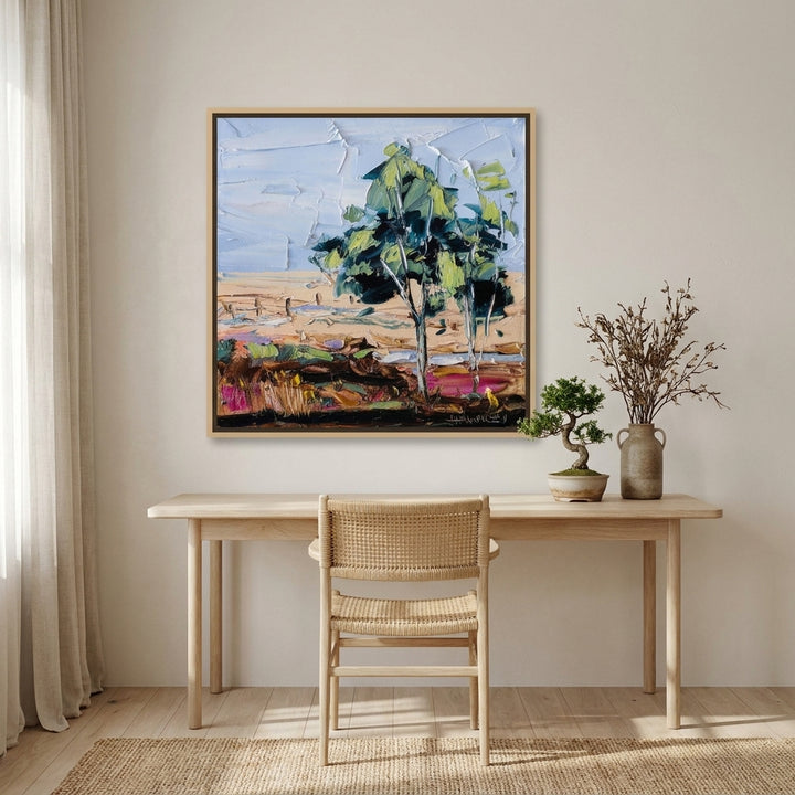 Canvas wall art with a natural timber surround styled on the wall in a warm Japandi home office