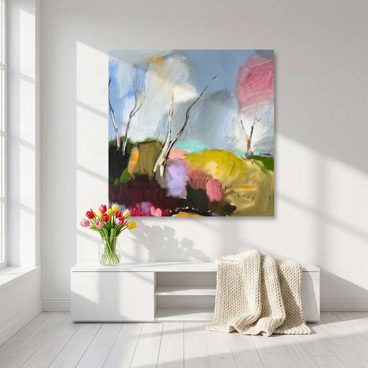 Stretched canvas wall art styled on the wall in a bright Scandinavian living room