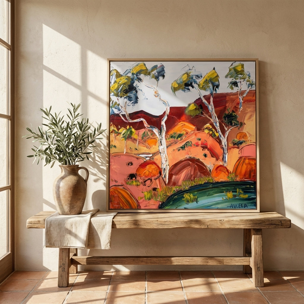 Canvas wall art with a natural timber surround standing on a bench in a Mediterranean home office