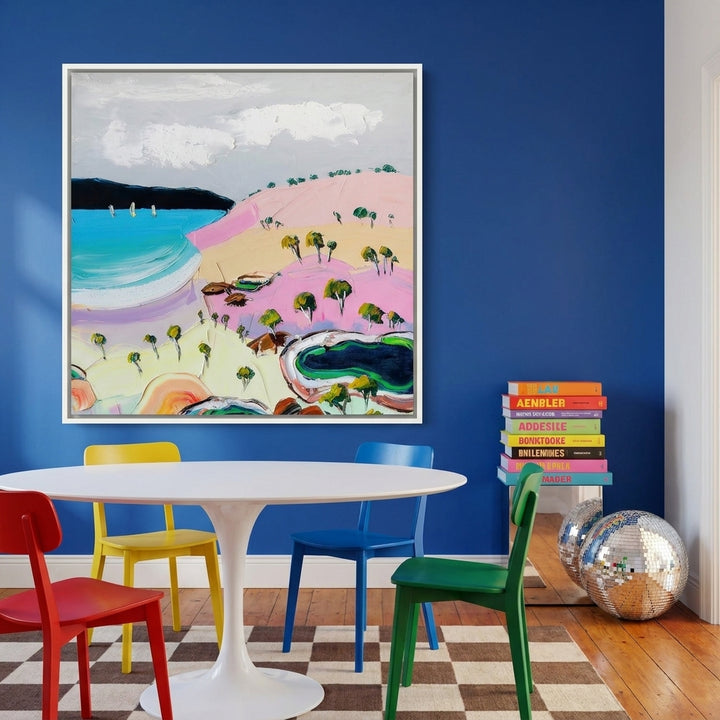Canvas wall art with a white surround styled on the wall in a colourful eclectic dining room