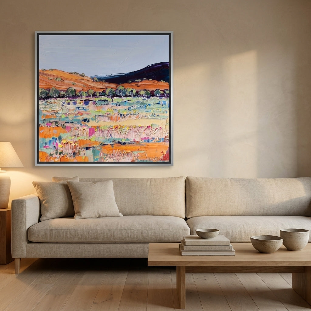 Canvas wall art with a silver leaf surround styled on the wall in a warm Japandi living room