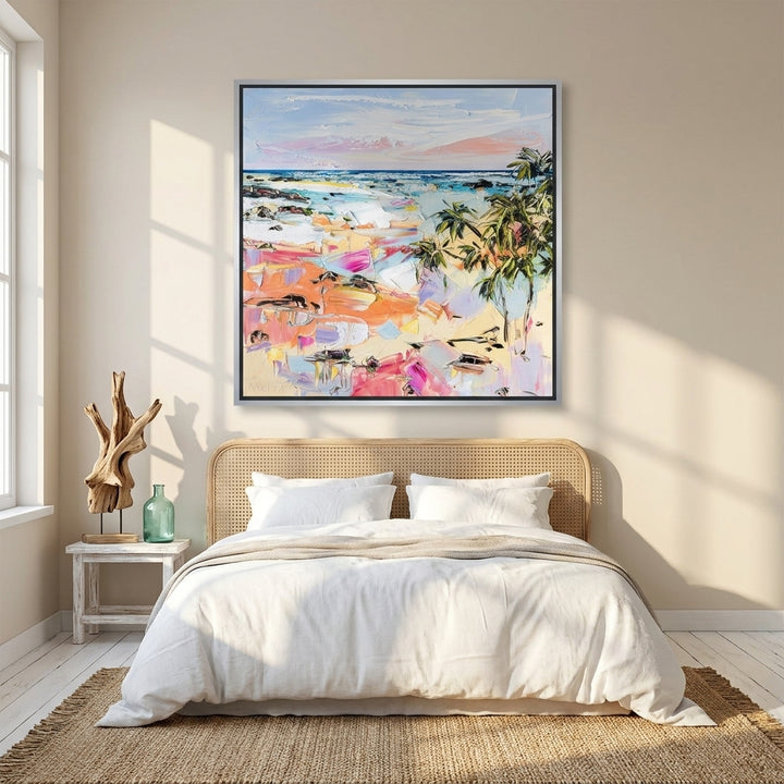 Canvas wall art with a silver leaf surround styled on the wall in a coastal bedroom
