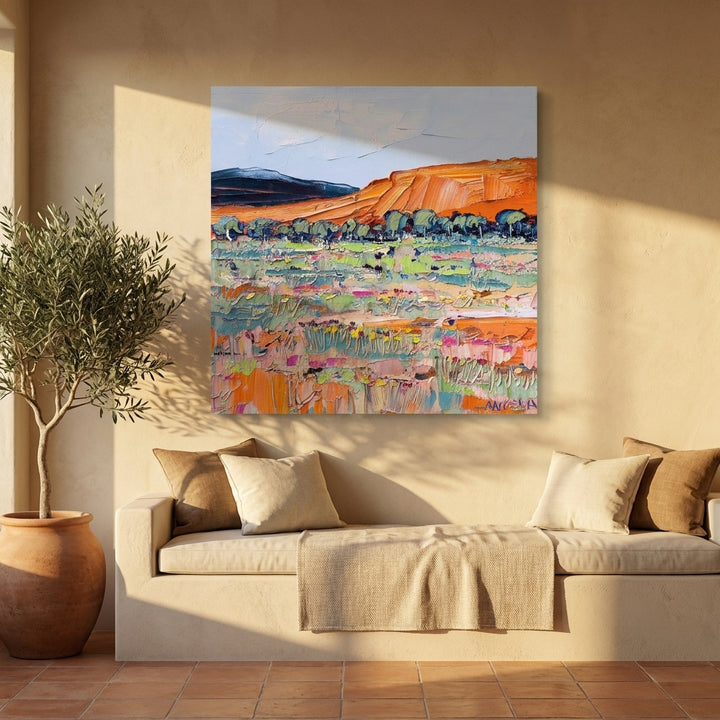 Stretched canvas wall art styled on the wall in a Mediterranean living room