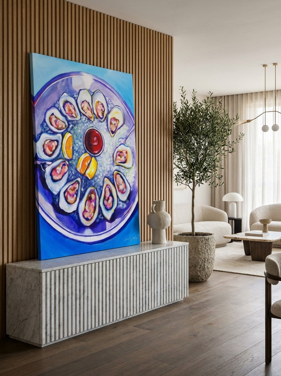 Stretched canvas wall art standing on a sideboard in a luxe living room