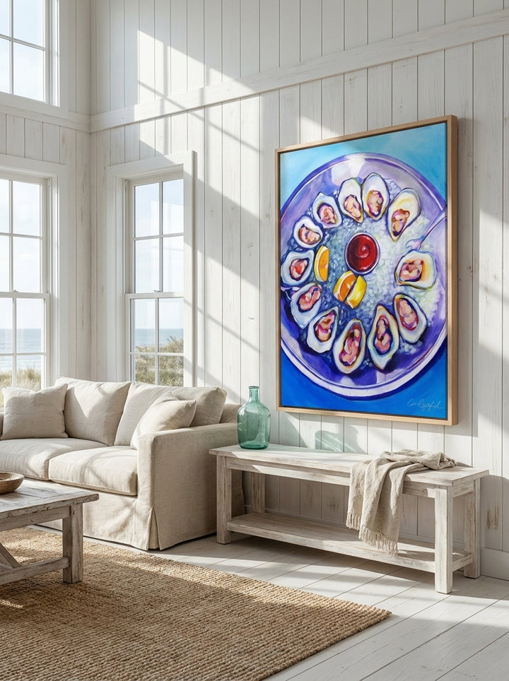 Oversized statement canvas wall art with a natural timber surround styled on the wall in a coastal living room