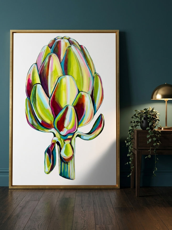 Oversized statement canvas wall art with a gold leaf surround leaning against the wall in a moody dining room