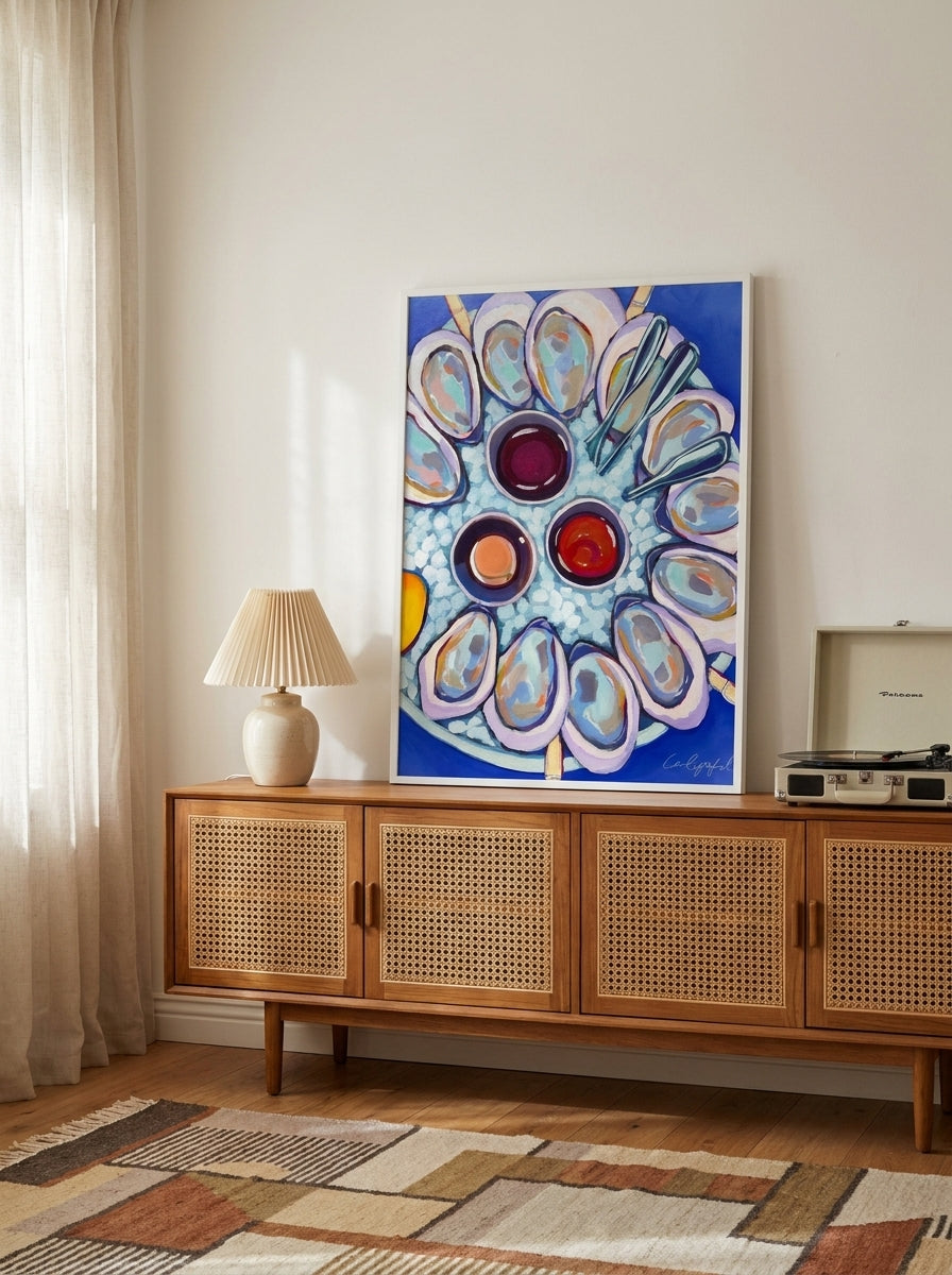 Modern wall art print standing on a sideboard in a mid-century living room