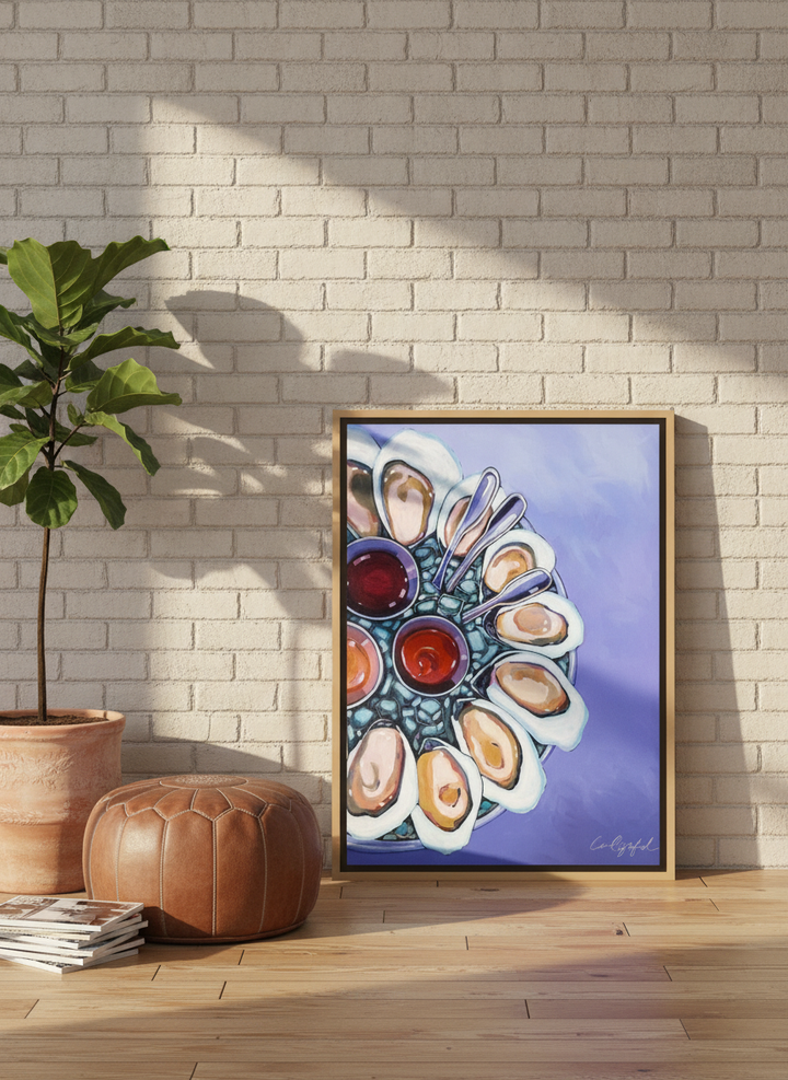Canvas wall art with a natural timber surround leaning against the wall in an industrial loft kitchen