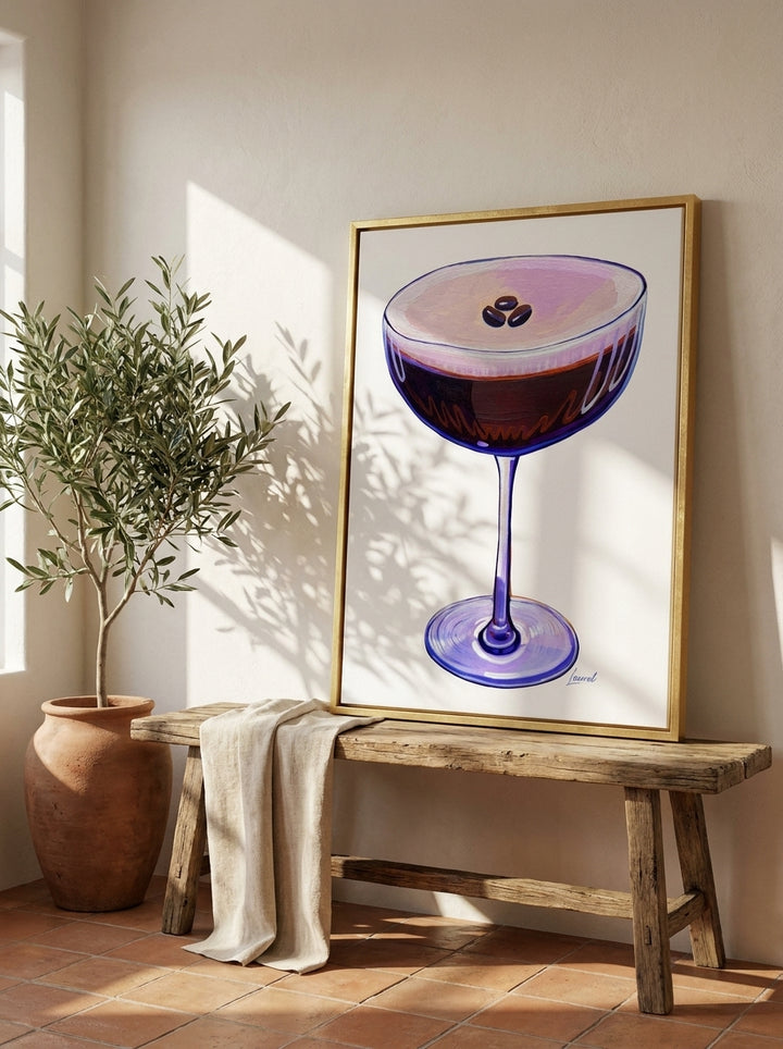 Canvas wall art with a gold leaf surround standing on a bench in a Mediterranean living room