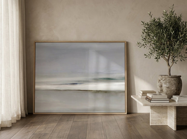Oversized statement modern wall art print leaning against the wall in a luxe bedroom